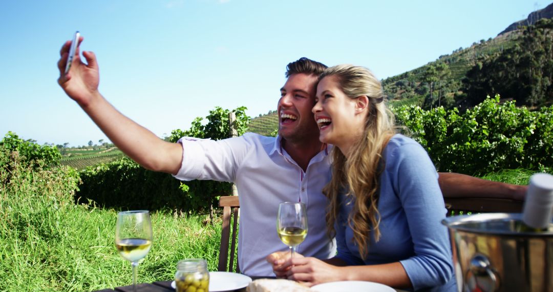 Couple Enjoying Wine at Vineyard Taking Selfie - Free Images, Stock Photos and Pictures on Pikwizard.com