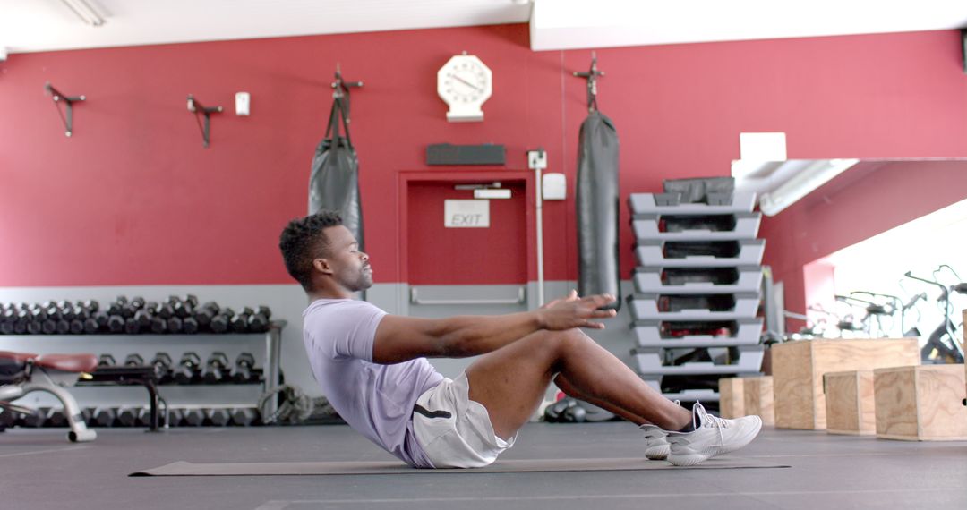 Fit African American Man Performing Core Exercises at Gym in Slow Motion