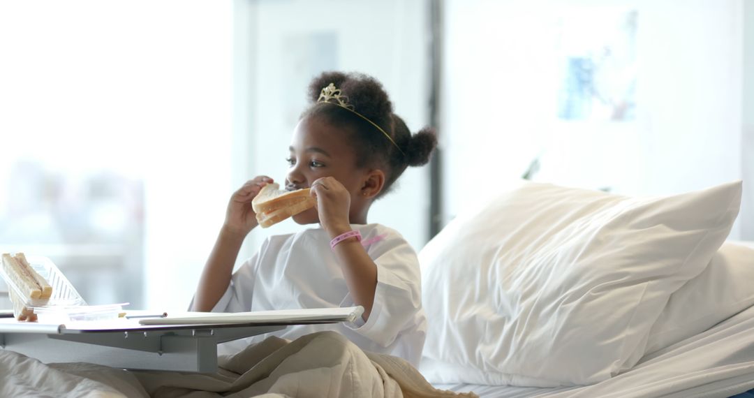 Young Girl Eating Sandwich in Hospital Bed - Free Images, Stock Photos and Pictures on Pikwizard.com