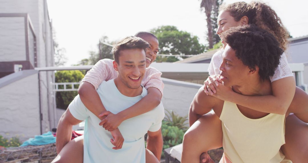Joyful Friends Having Fun at Pool Party in Backyard