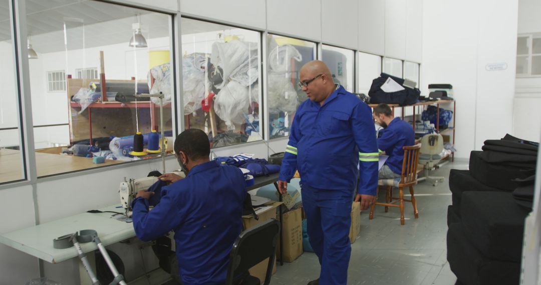 Supervising Workers in Garment Factory with Sewing Machines - Free Images, Stock Photos and Pictures on Pikwizard.com