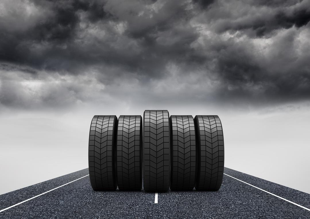 Five Tires on Asphalt Road Under Stormy Sky - Free Images, Stock Photos and Pictures on Pikwizard.com