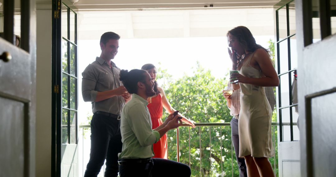 Man Proposing with Ring, Emotional Restaurant Balcony Surprise - Free Images, Stock Photos and Pictures on Pikwizard.com