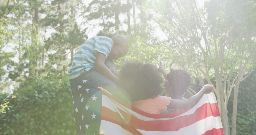 Young African American Family Holding American Flag - Free Images, Stock Photos and Pictures on Pikwizard.com