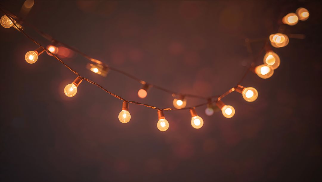 Warm Amber String Lights Casting Cozy Patio Ambiance with Glowing Filament Bulbs and Bokeh