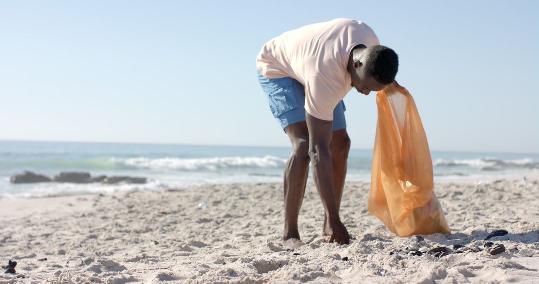 Man Cleans Beach for Environmental Efforts Slow Motion
