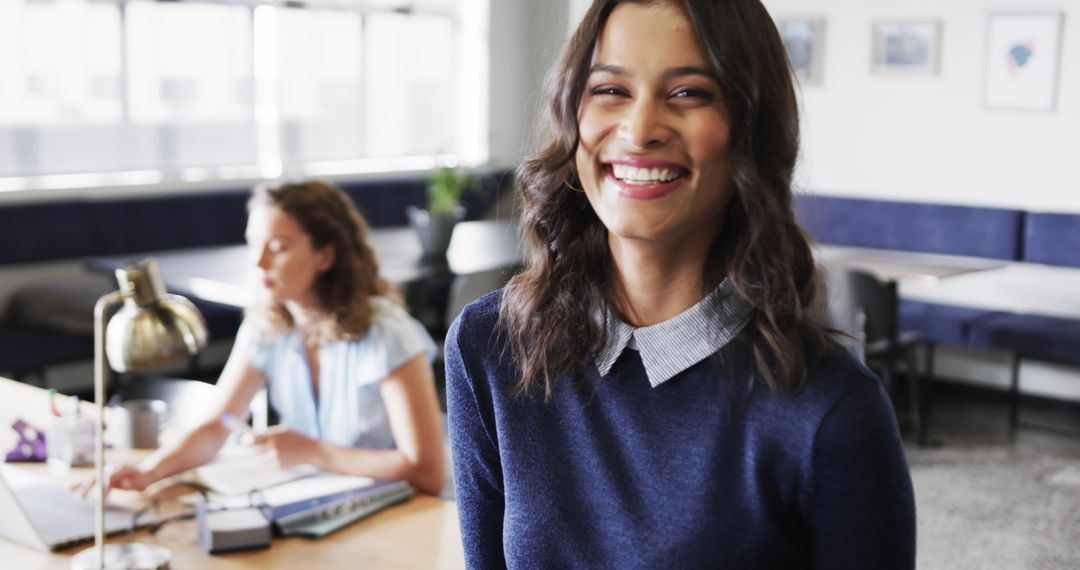 Biracial Businesswoman Smiling in Contemporary Office Environment