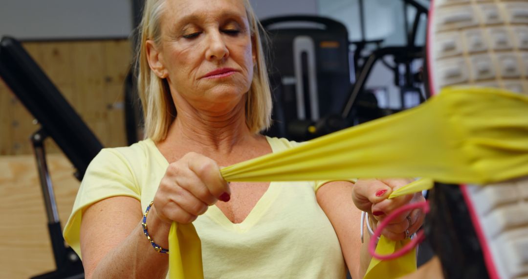 Senior Woman Using Resistance Band for Exercise Routine - Free Images, Stock Photos and Pictures on Pikwizard.com