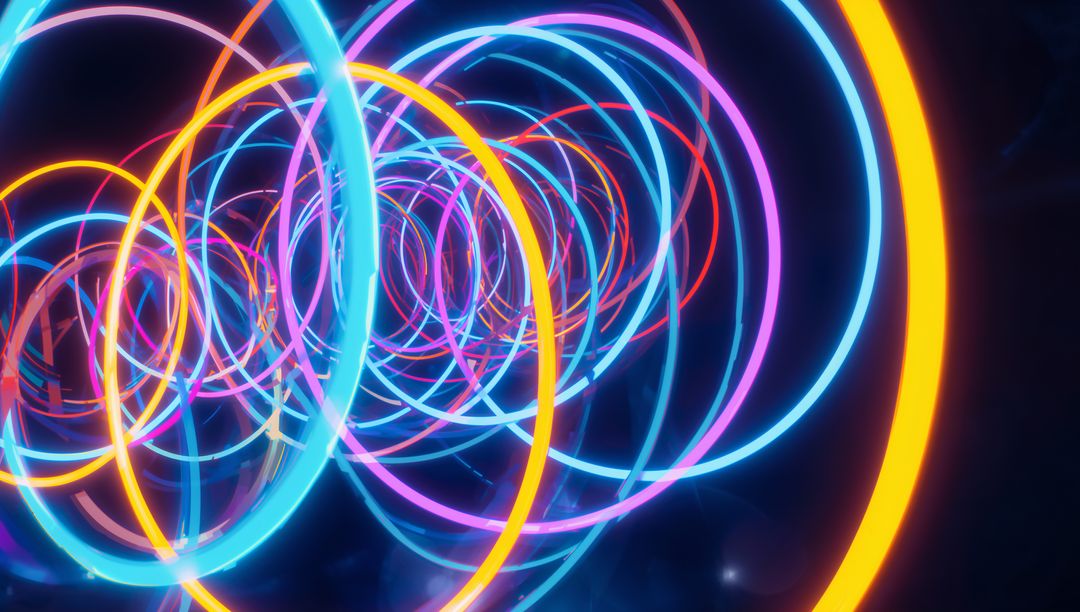 Spiraling neon rings forming glowing tunnel of multicolor concentric circles and light
