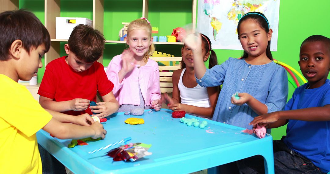 Diverse Group of Children Smiling and Playing at Craft Table in Classroom - Free Images, Stock Photos and Pictures on Pikwizard.com