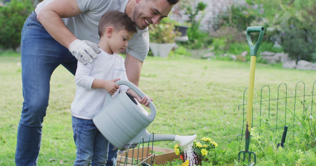 Father and Son Watering Plants in Garden on Sunny Day - Free Images, Stock Photos and Pictures on Pikwizard.com