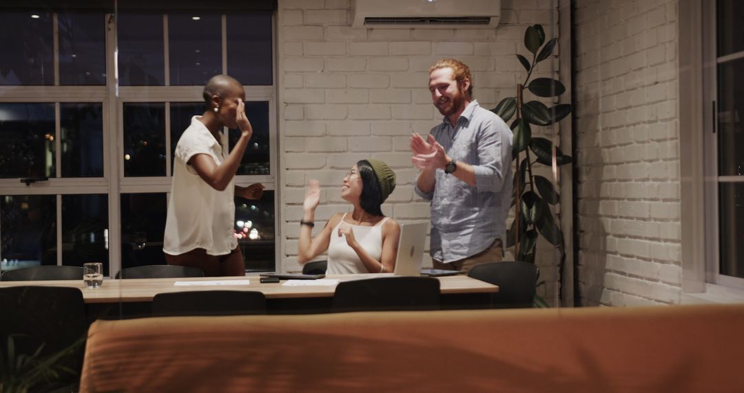 Diverse Team Collaborating for Nighttime Office Project