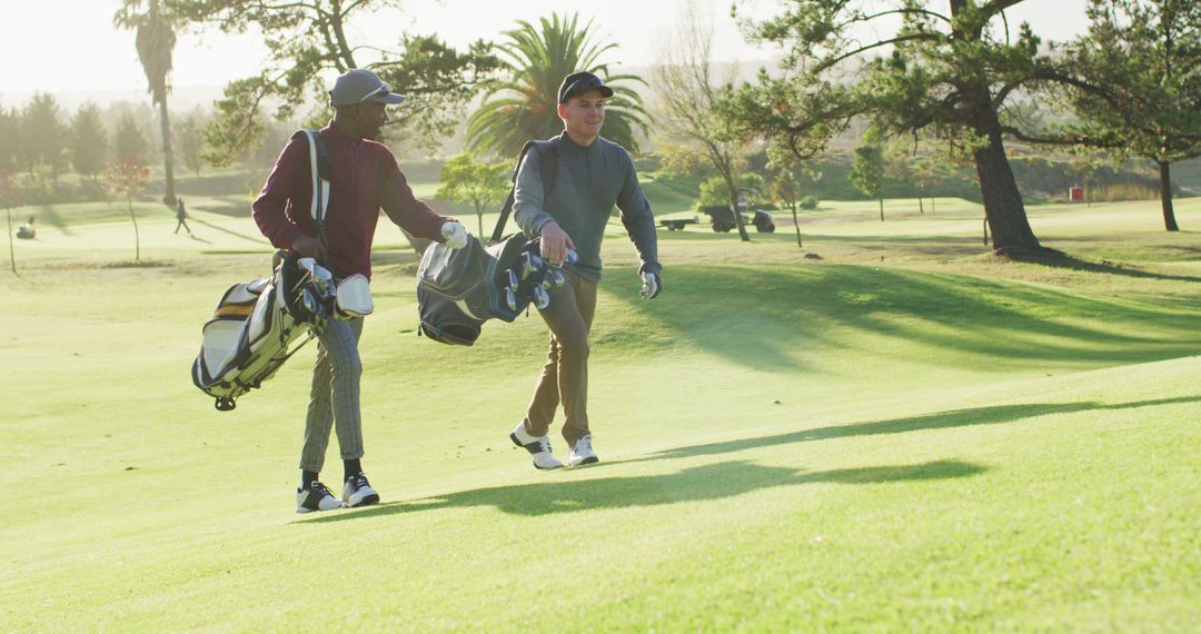Image of diverse male friends walking on golf field - Free Images, Stock Photos and Pictures on Pikwizard.com