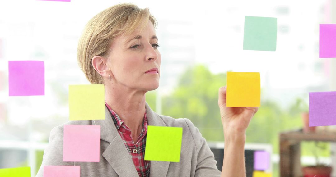 Focused Professional Planning with Colorful Sticky Notes - Free Images, Stock Photos and Pictures on Pikwizard.com