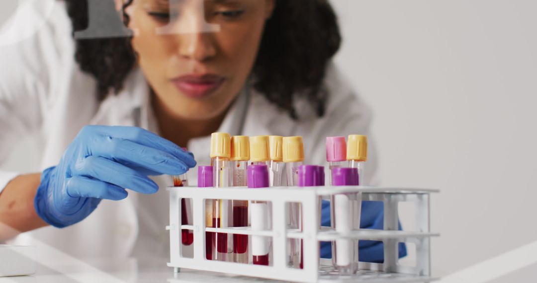 Female Scientist Examining Test Tubes in Laboratory