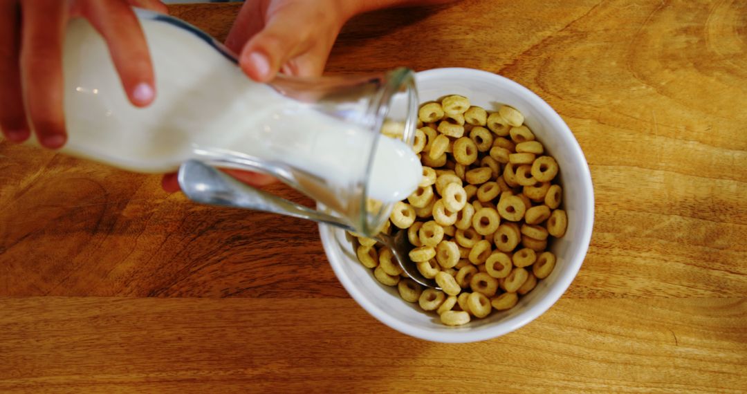 Pouring Milk into Bowl of Breakfast Cereal - Free Images, Stock Photos and Pictures on Pikwizard.com