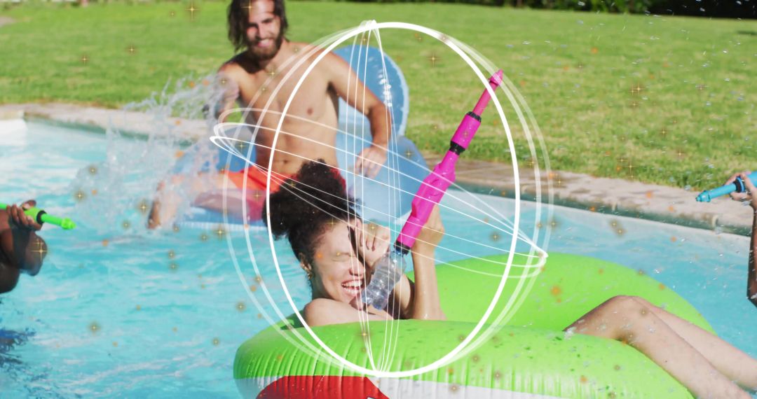 Friends splashing with colorful water blasters floating on inflatable tubes in backyard pool