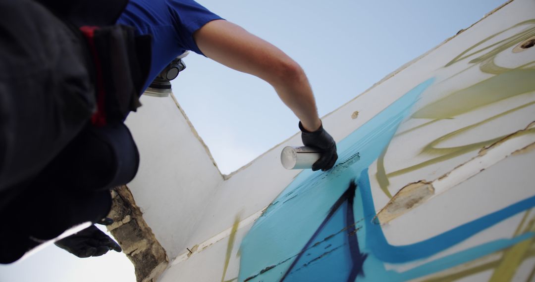 Street Artist Creating Graffiti Mural on Wall - Free Images, Stock Photos and Pictures on Pikwizard.com