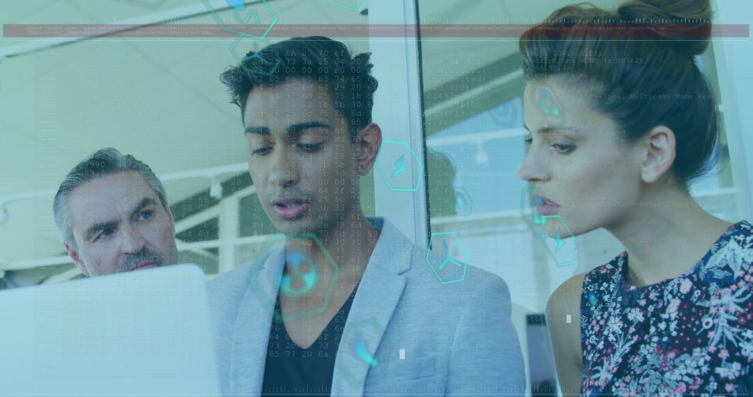 Innovative Team Reviewing Data on Laptop in Modern Office