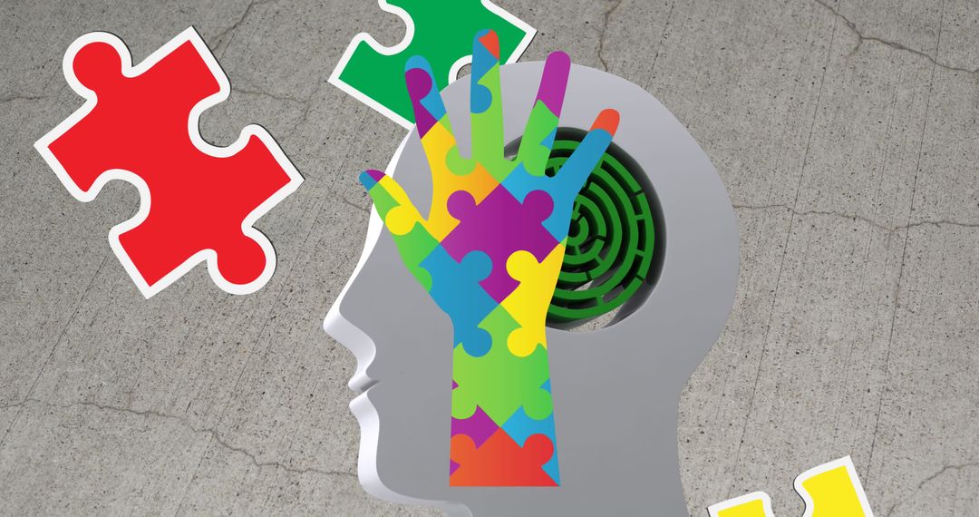 Autism Awareness Concept with Puzzle Pieces Hand and Head