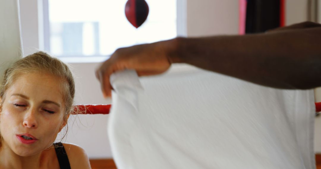 Boxing Trainer Wiping Sweat Off Female Boxer During Training - Free Images, Stock Photos and Pictures on Pikwizard.com