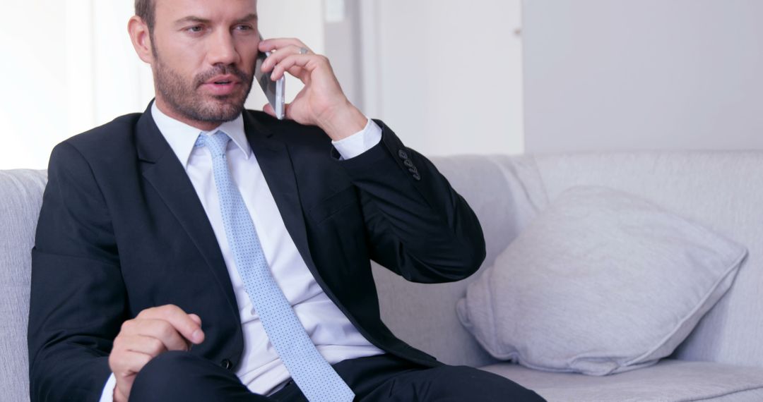 Business Professional Talking on Phone in Modern Office Setting - Free Images, Stock Photos and Pictures on Pikwizard.com