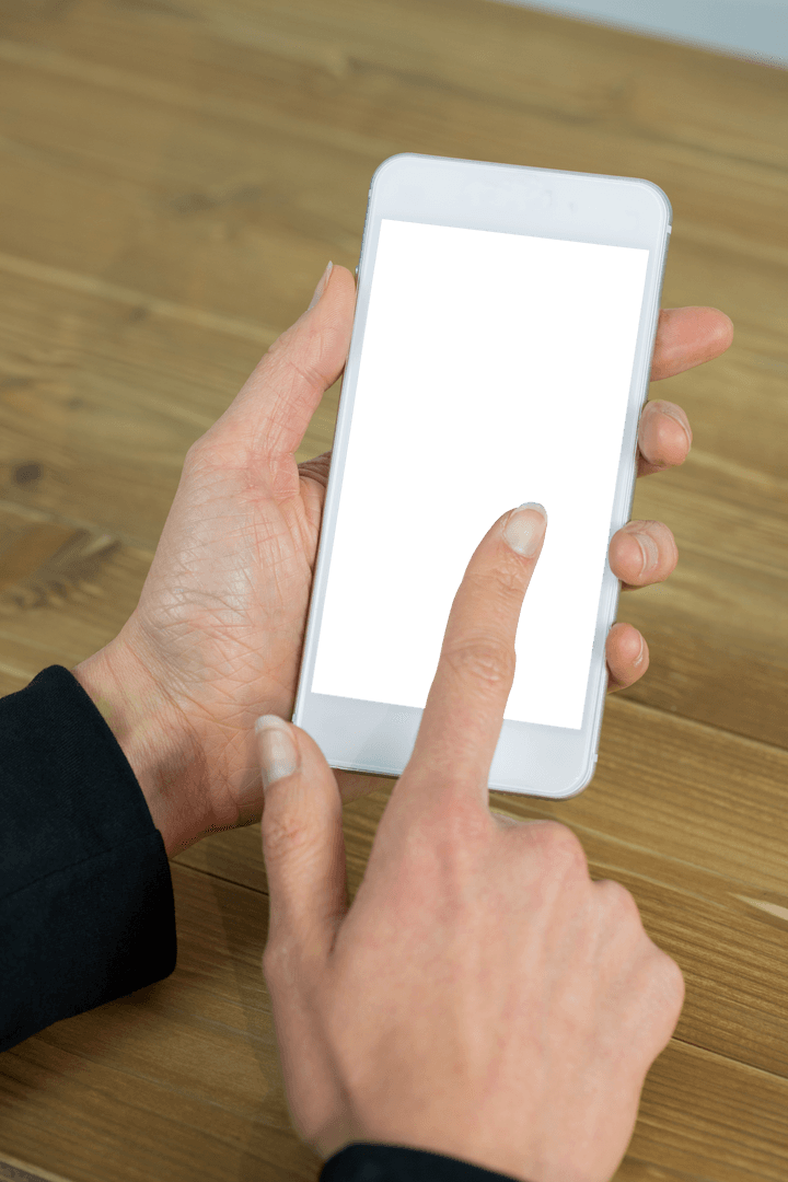 Businesswoman's Hands Using Transparent Smartphone Screen at Wooden Desk