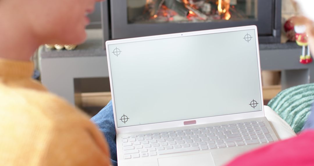 People Using Laptop with Fireplace in Background - Free Images, Stock Photos and Pictures on Pikwizard.com