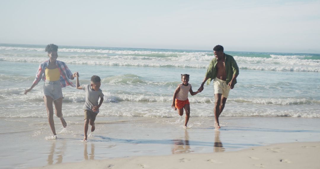 Happy Family Running on Beach Shore in Sunlight - Free Images, Stock Photos and Pictures on Pikwizard.com