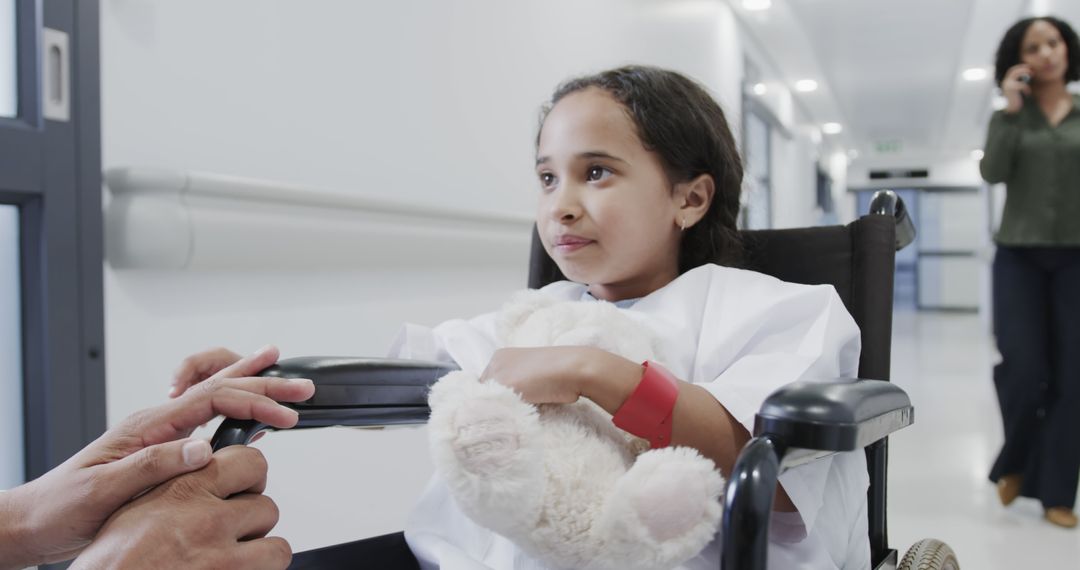 Young Girl in Hospital Wheelchair Holding Teddy Bear - Free Images, Stock Photos and Pictures on Pikwizard.com