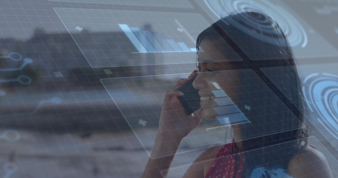 Smiling woman holding smartphone with holographic analytics overlay in modern workspace