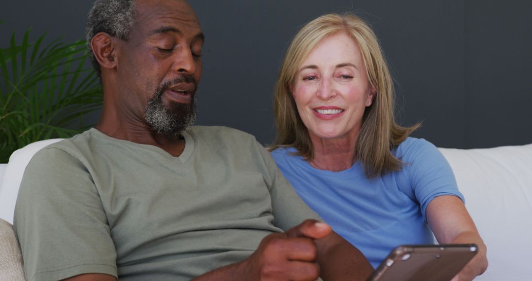 Senior Couple Relaxing on Couch Using Smartphone Together - Free Images, Stock Photos and Pictures on Pikwizard.com