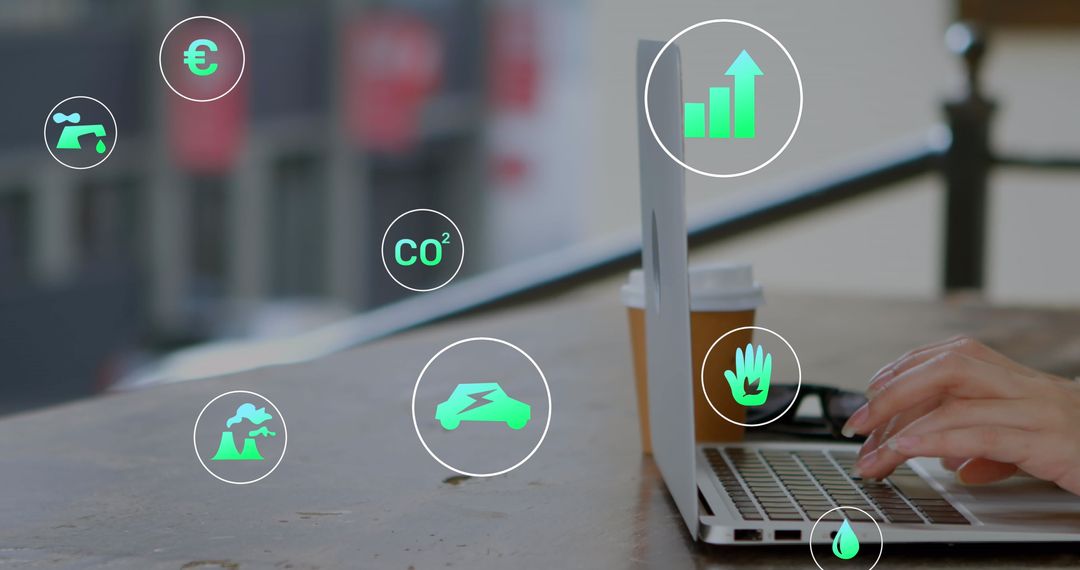 Hands Typing with Digital Icons Indicating Environmental Data