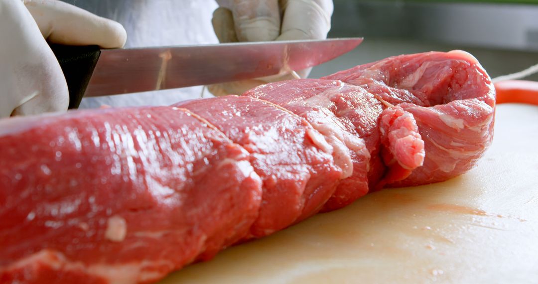 Butcher Preparing a Large Cut of Beef on Wooden Board - Free Images, Stock Photos and Pictures on Pikwizard.com