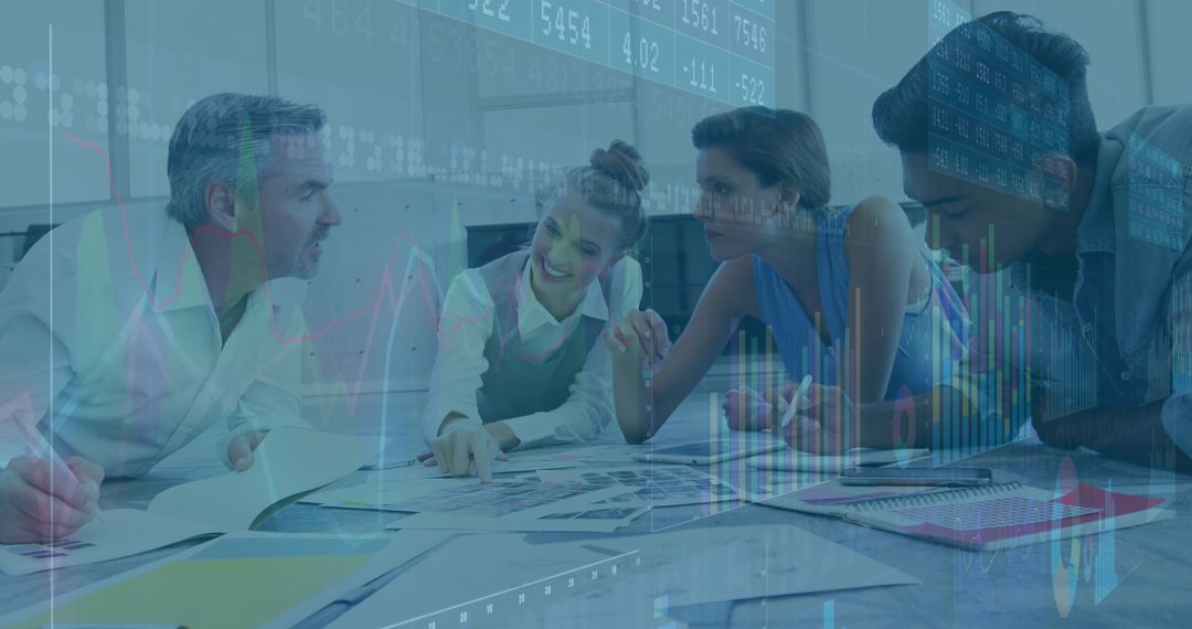 Business Team Collaborating on Financial Reports with Overlay of Graphs