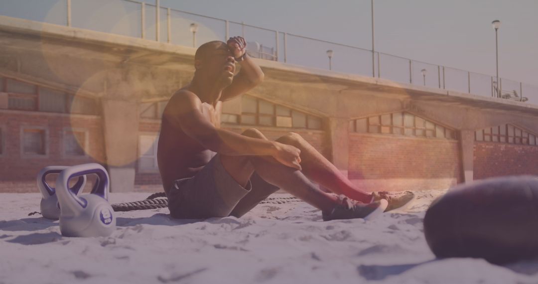 Exhausted Athlete Resting During Beach Workout