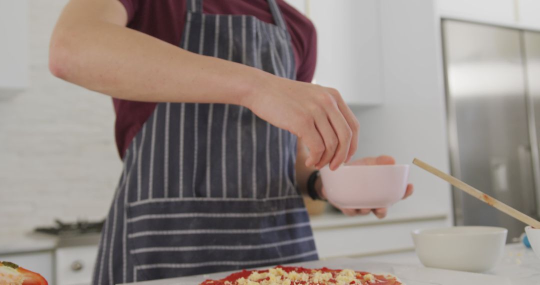 Individual Preparing Homemade Pizza in Modern Kitchen - Free Images, Stock Photos and Pictures on Pikwizard.com