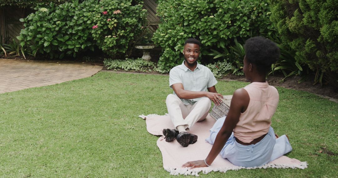 Joyful Couple Bonding in Lush Garden Setting