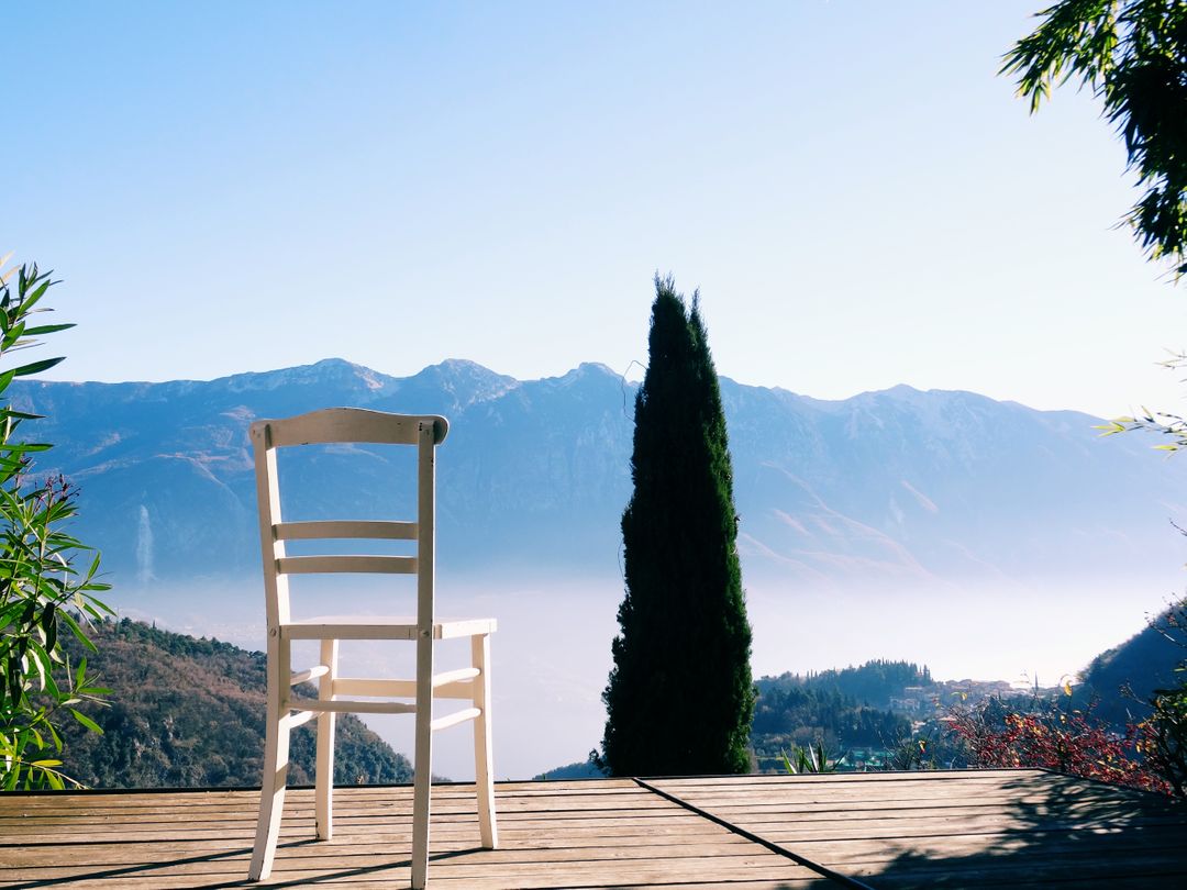 White Wooden Chair on Deck with Scenic Mountain View - Free Images, Stock Photos and Pictures on Pikwizard.com