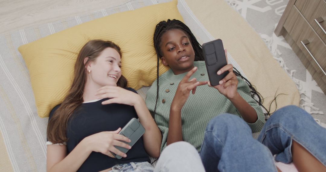 Teen Friends Relaxing with Smartphones at Home - Free Images, Stock Photos and Pictures on Pikwizard.com