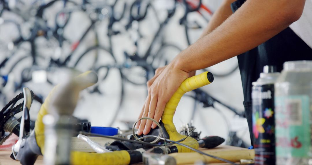 Person Repairing Bicycle Handlebar in Workshop - Free Images, Stock Photos and Pictures on Pikwizard.com