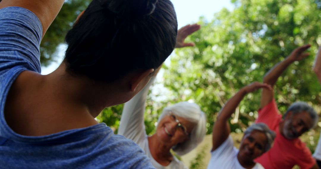 Group of Diverse Seniors Exercising Outdoors with Instructor - Free Images, Stock Photos and Pictures on Pikwizard.com