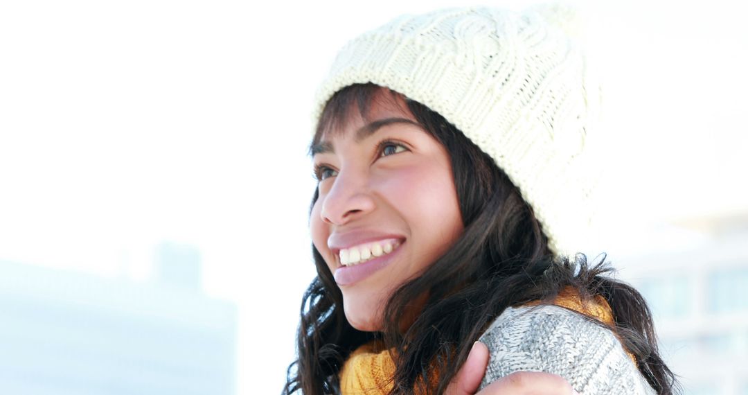 Cheerful Latina Girl Embracing Winter in Cozy Hat and Scarf - Free Images, Stock Photos and Pictures on Pikwizard.com