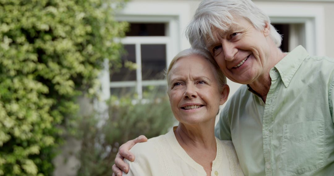 Senior Couple Embracing and Smiling Outdoors - Free Images, Stock Photos and Pictures on Pikwizard.com