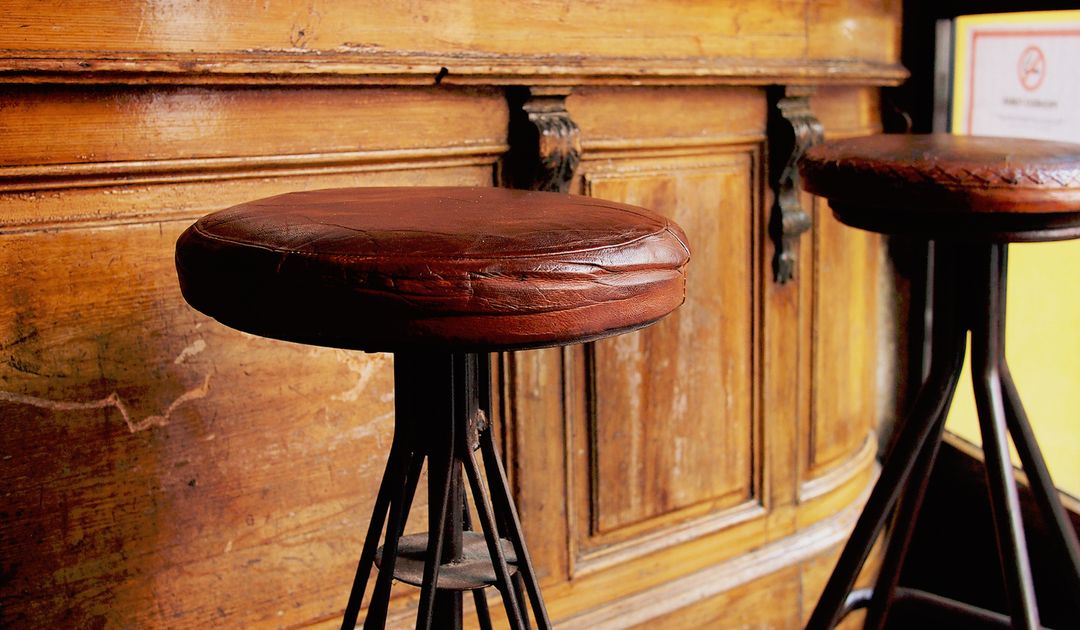 Vintage Bar Stools Against Rustic Wooden Counter