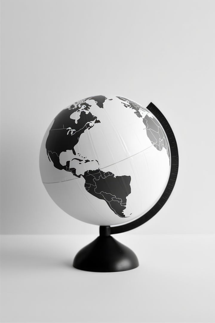 A monochrome globe sits on a plain background, with copy space - Free Images, Stock Photos and Pictures on Pikwizard.com