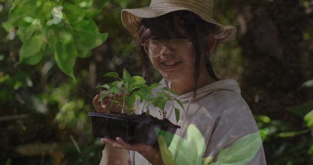 Girl with Seedling Tray in Forest Environment