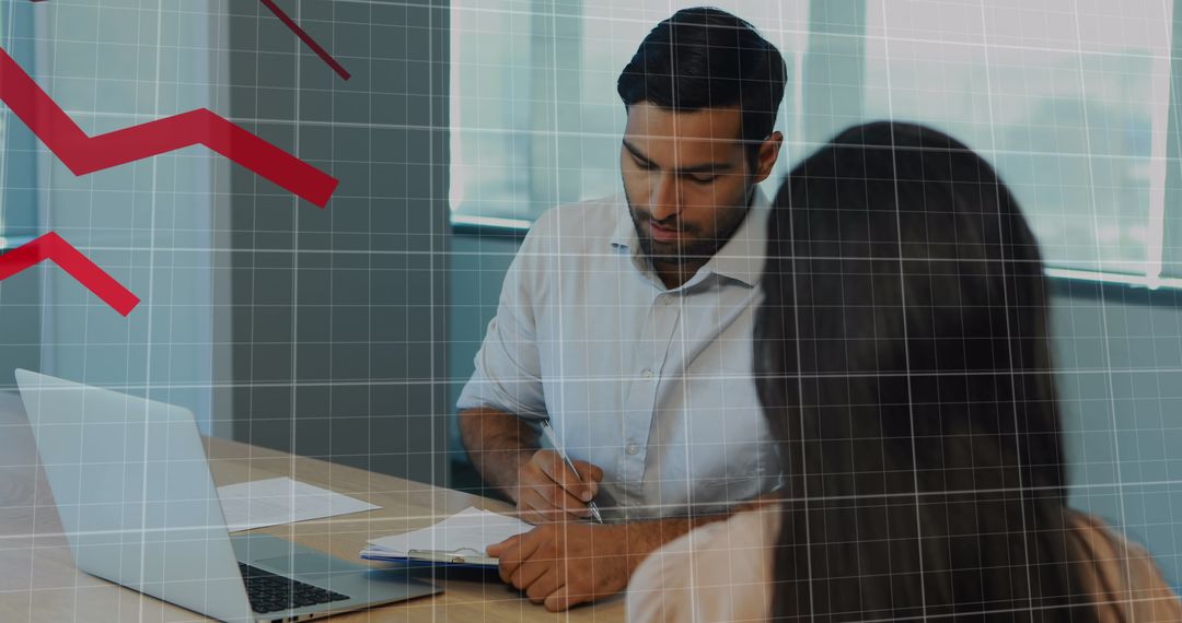 Business Team Analyzing Financial Data with Trend Graphs