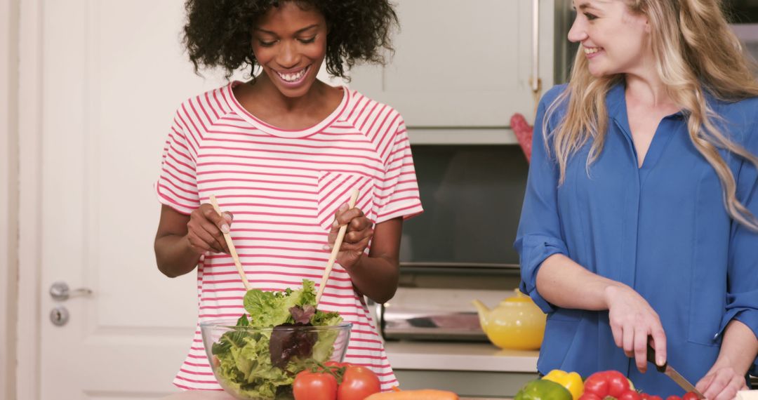 Two Women Preparing Healthy Salad in Modern Kitchen - Free Images, Stock Photos and Pictures on Pikwizard.com