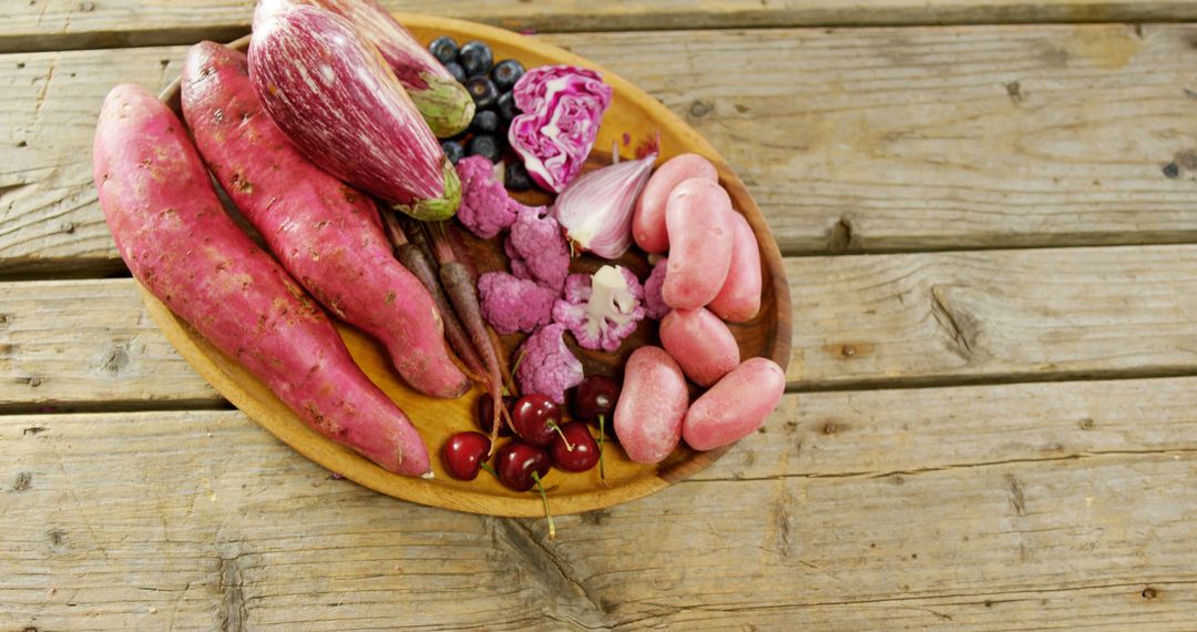 Assorted Purple Vegetables and Fruits on Wooden Surface - Free Images, Stock Photos and Pictures on Pikwizard.com